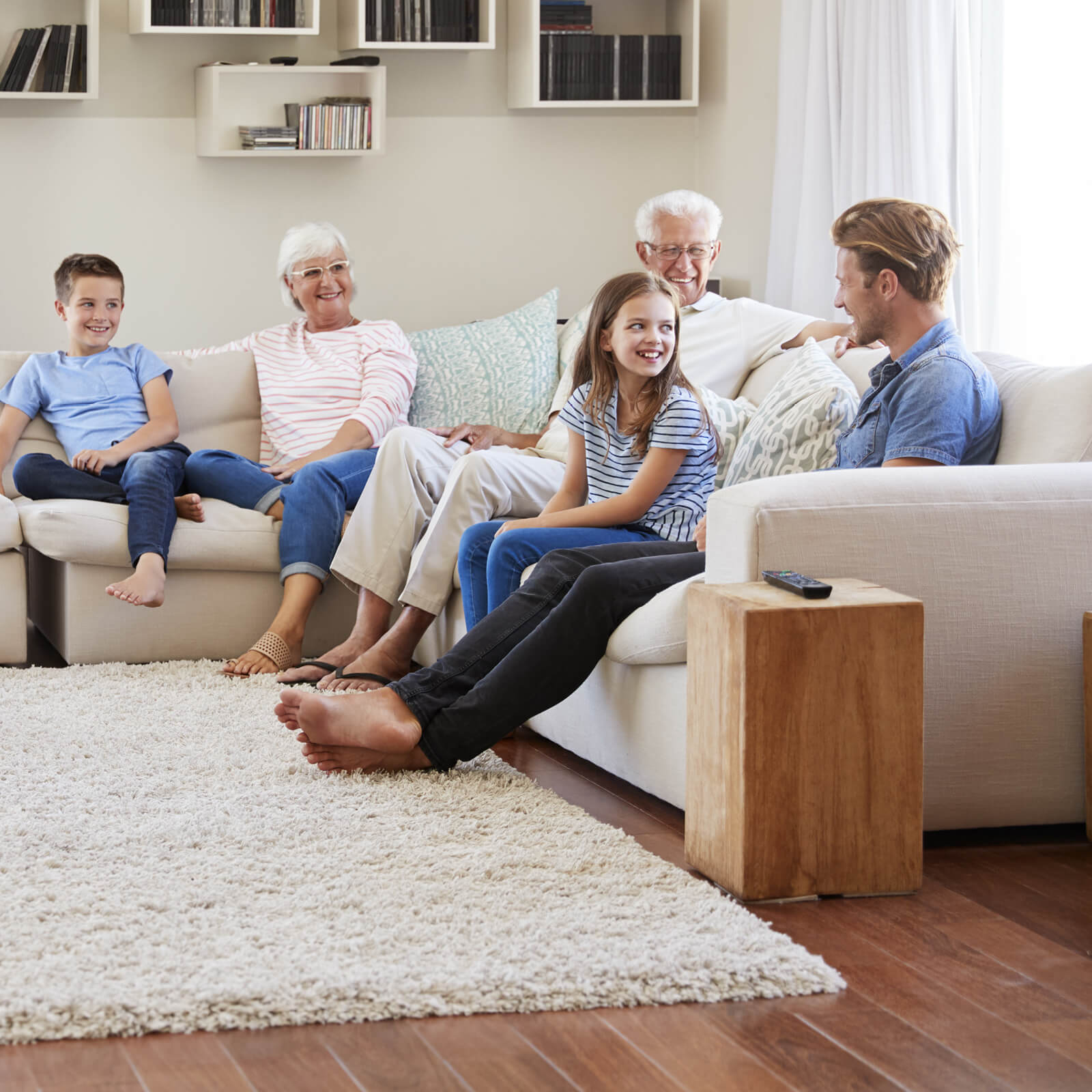Family enjoying in living room | Towne Flooring Center